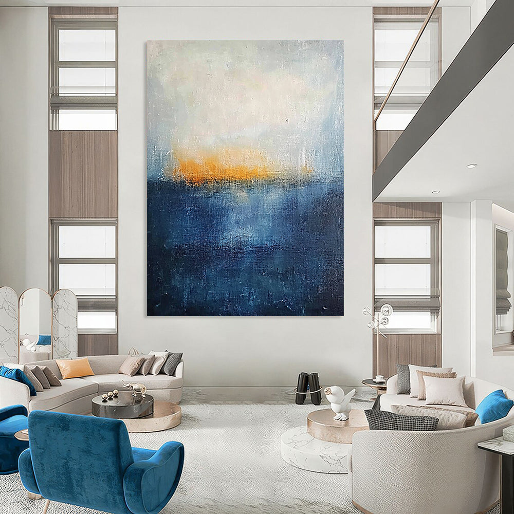 Contemporary abstract painting featuring thick textured layers in dark blue and yellow hues evoking a serene landscape with a tranquil sea and foggy horizon. DLZ0356
