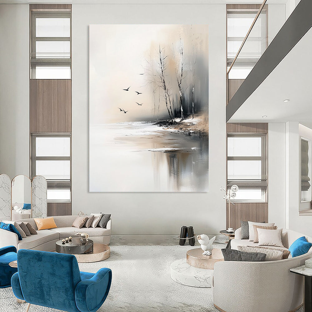 Large contemporary abstract painting featuring serene trees by an ice-covered lake with flying birds in soft gray and beige tones. DLZ0411