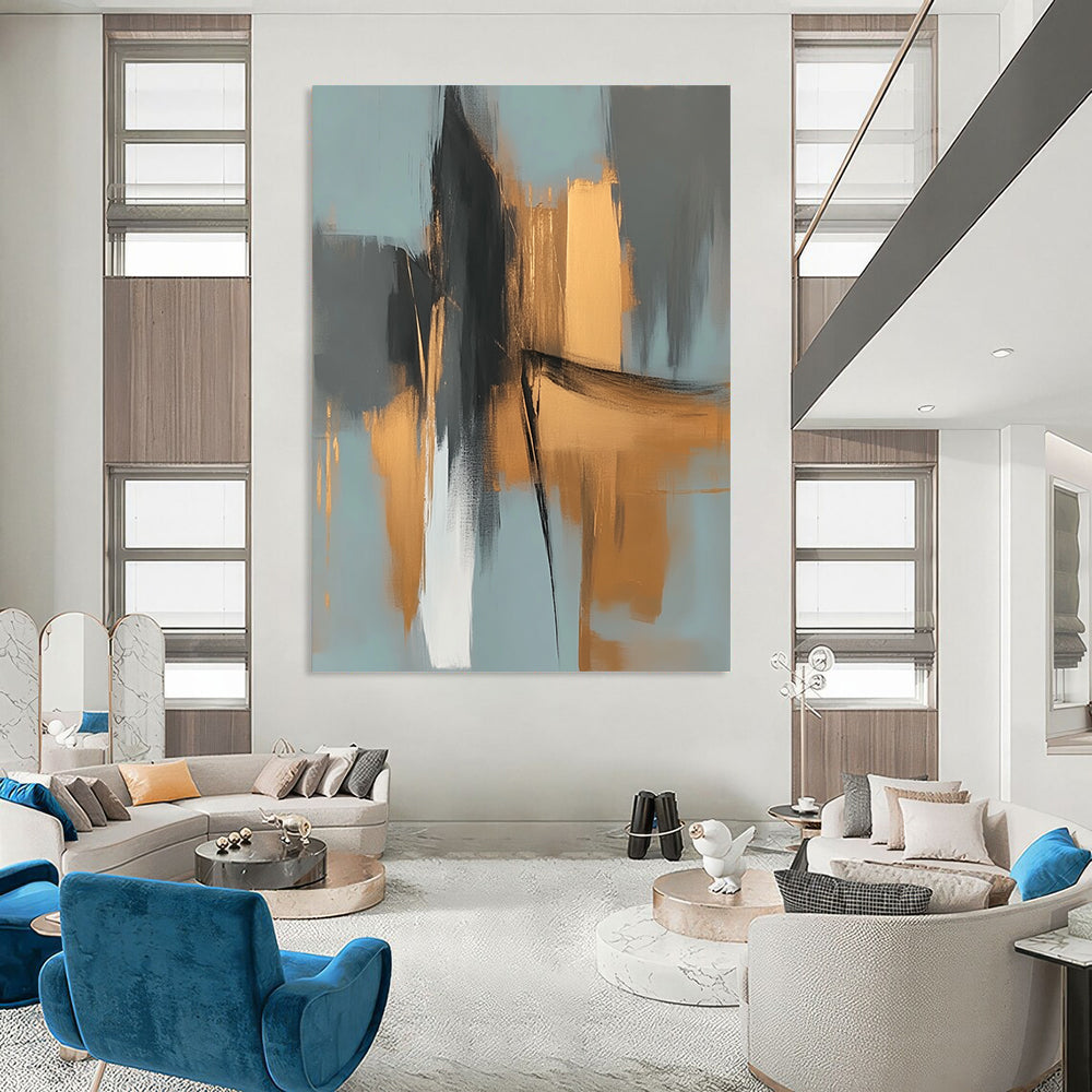 Large contemporary abstract painting features elegant gold and gray shapes against a light blue background evoking an urban landscape with serene organic forms. DLZ0706