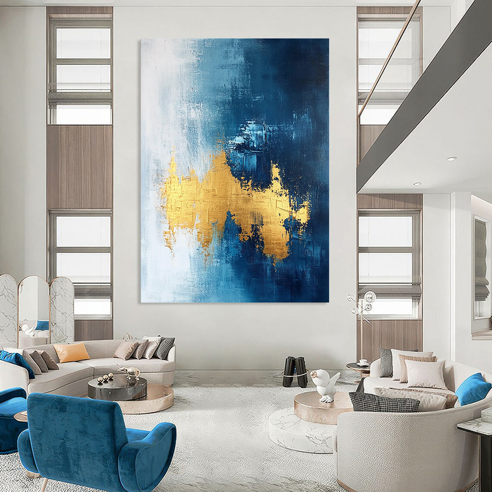 Contemporary abstract painting features gold leafing on a dark blue white and light gray background with elegant brush strokes and a sophisticated texture. DLZ0334
