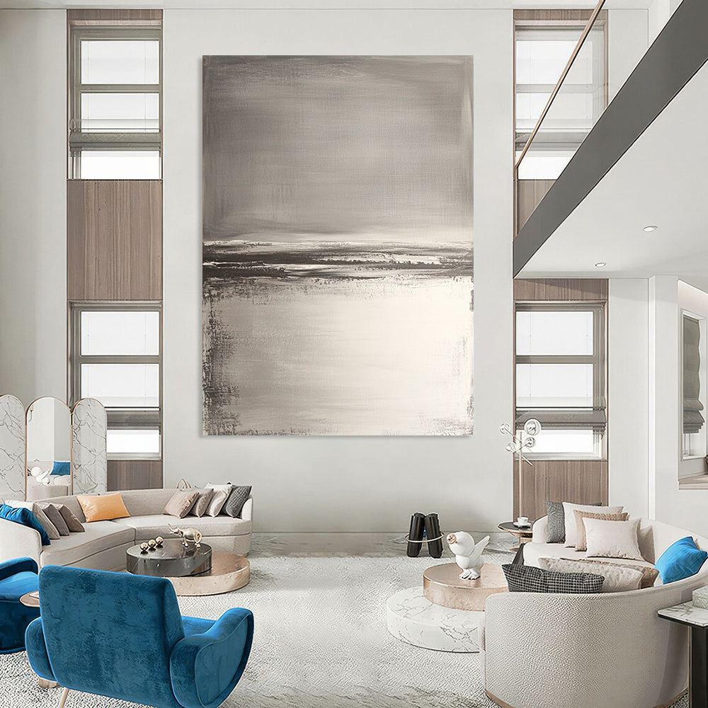 Contemporary hand-painted abstract artwork features neutral tones with gray and white, textured water reflections, and soft brush strokes for a serene beach landscape. DLZ0390