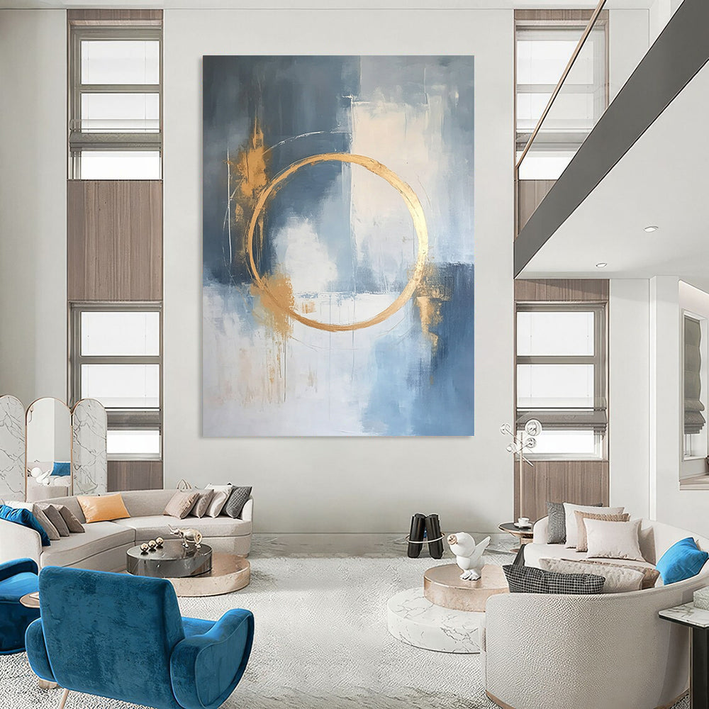 Large contemporary abstract painting features a light blue and white background with gold accents and elegant lines for a high-end aesthetic. DLZ0545