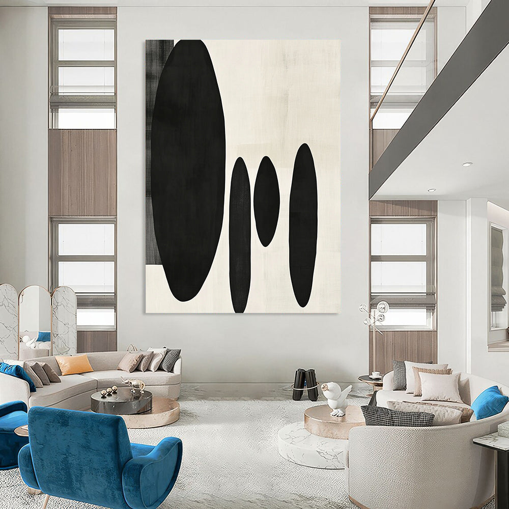 Contemporary minimalist artwork featuring organic black shapes balancing large forms on the left with delicate smaller shapes on the right. DLZ1547