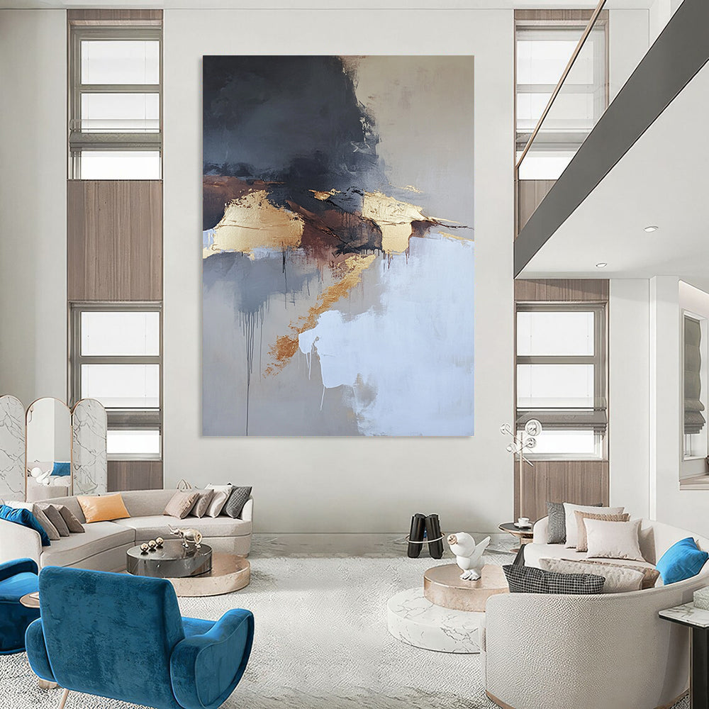 Contemporary abstract painting features aerial views with dark gray and white clouds gold elements in beige tones and thick brush strokes. DLZ0448