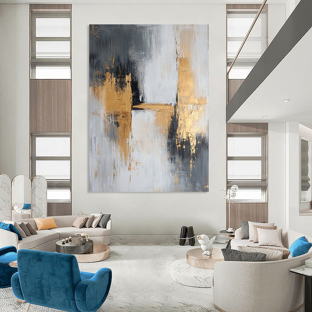 Large contemporary abstract painting featuring gray and gold tones with textured brush strokes that evoke calmness and tranquility on a spacious canvas. DLZ0709