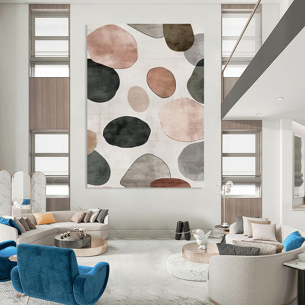 Contemporary hand-painted abstract artwork features a serene design of overlapping circles and pebbles in shades of gray with brown green and pink accents. DLZ1646