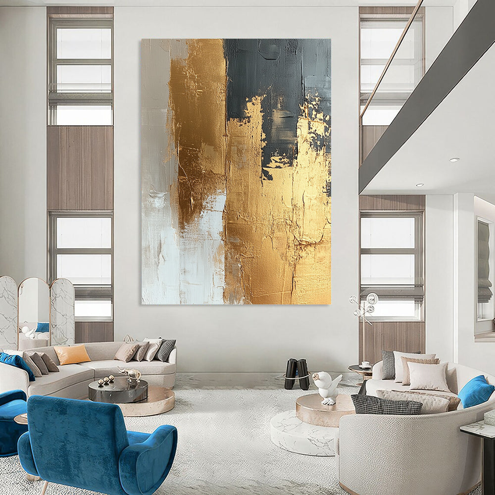 Contemporary abstract painting featuring textured gold foil on a beige and white canvas showcasing dynamic brushstrokes and a refined neutral palette. DLZ1019