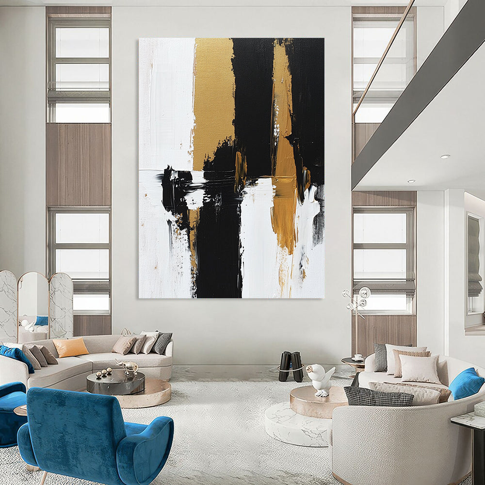 Contemporary hand-painted abstract artwork features bold brush strokes and rich textures in black, white, and gold tones on canvas. DLZ0495