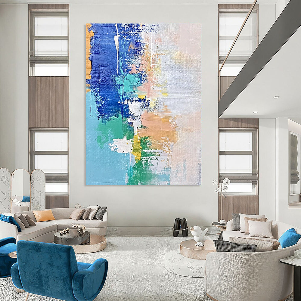 Contemporary hand-painted abstract artwork features soft pastel shades of blue and white with hints of green and beige, enhanced by dynamic brush strokes and mixed media. DLZ0657