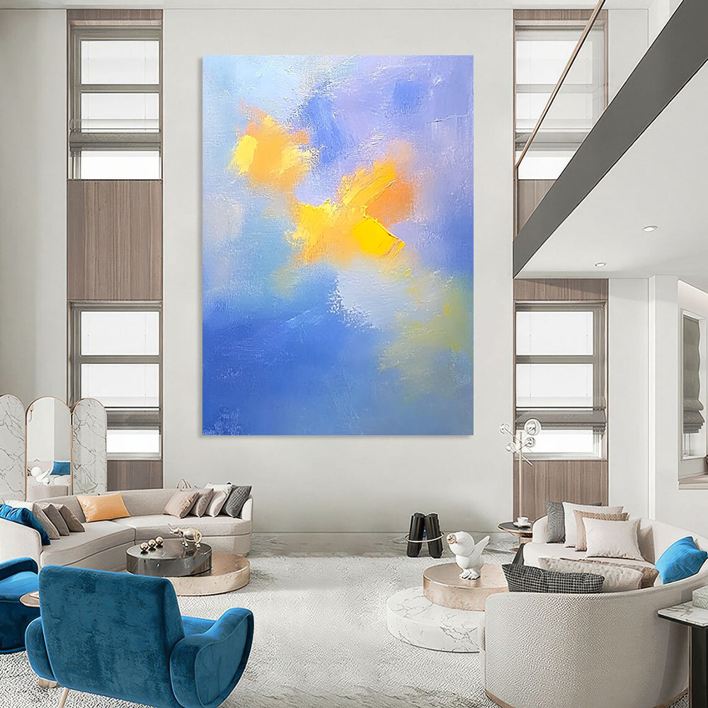 Contemporary abstract painting featuring soft blue and yellow clouds with gentle oil strokes on canvas, inspired by the style of Cuno Amiet. DLZ0354