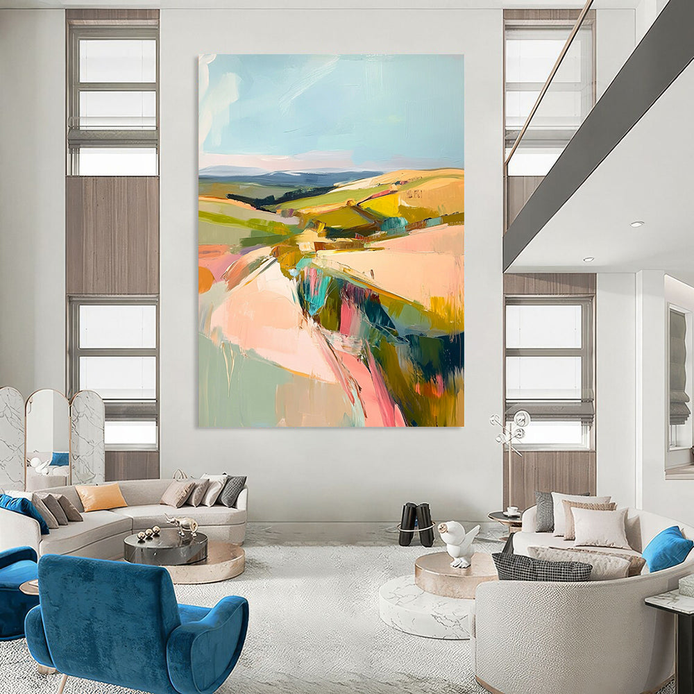 Large contemporary abstract painting featuring a pastel palette of pinks greens and yellows capturing the beauty of Welsh rolling hills and blue skies. DLZ1003