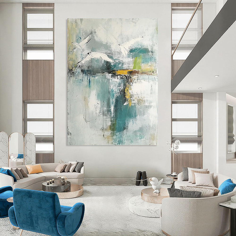 Contemporary hand-painted abstract artwork features neutral hues with teal and gold accents soft watercolors evoke birds over a lake with serene reflections. DLZ0758