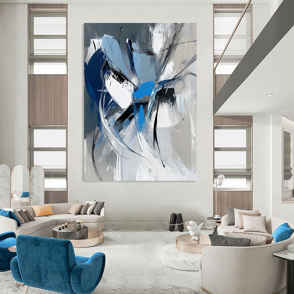 Large contemporary hand-painted abstract art featuring dynamic white gray and blue shapes with bold brushstrokes and a vibrant urban energy. DLZ1008