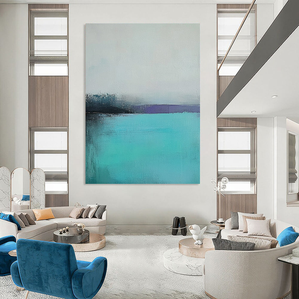 Large contemporary hand-painted abstract artwork captures a tranquil turquoise sea with a misty gray sky using muted colors and soft brush strokes for emotional depth. DLZ0428