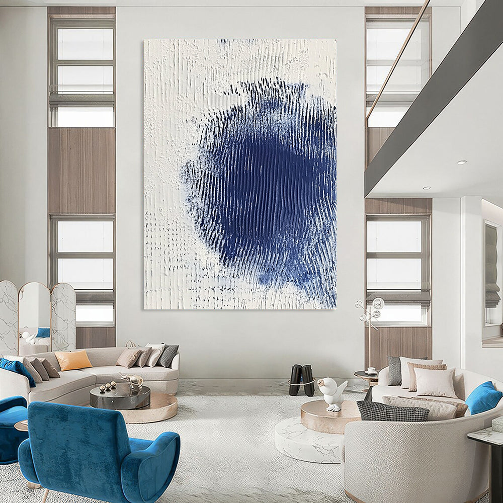 Contemporary abstract art featuring serene white and blue textures with a central dark blue spot creating depth and minimalistic elegance. DLZ1223