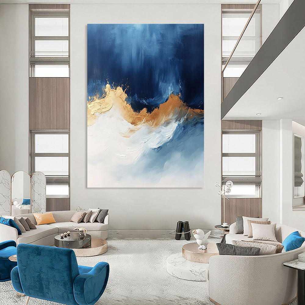 Contemporary abstract art features bold blue white and gold hues with sweeping brushstrokes energizing the canvas creating depth and visual allure. DLZ0335