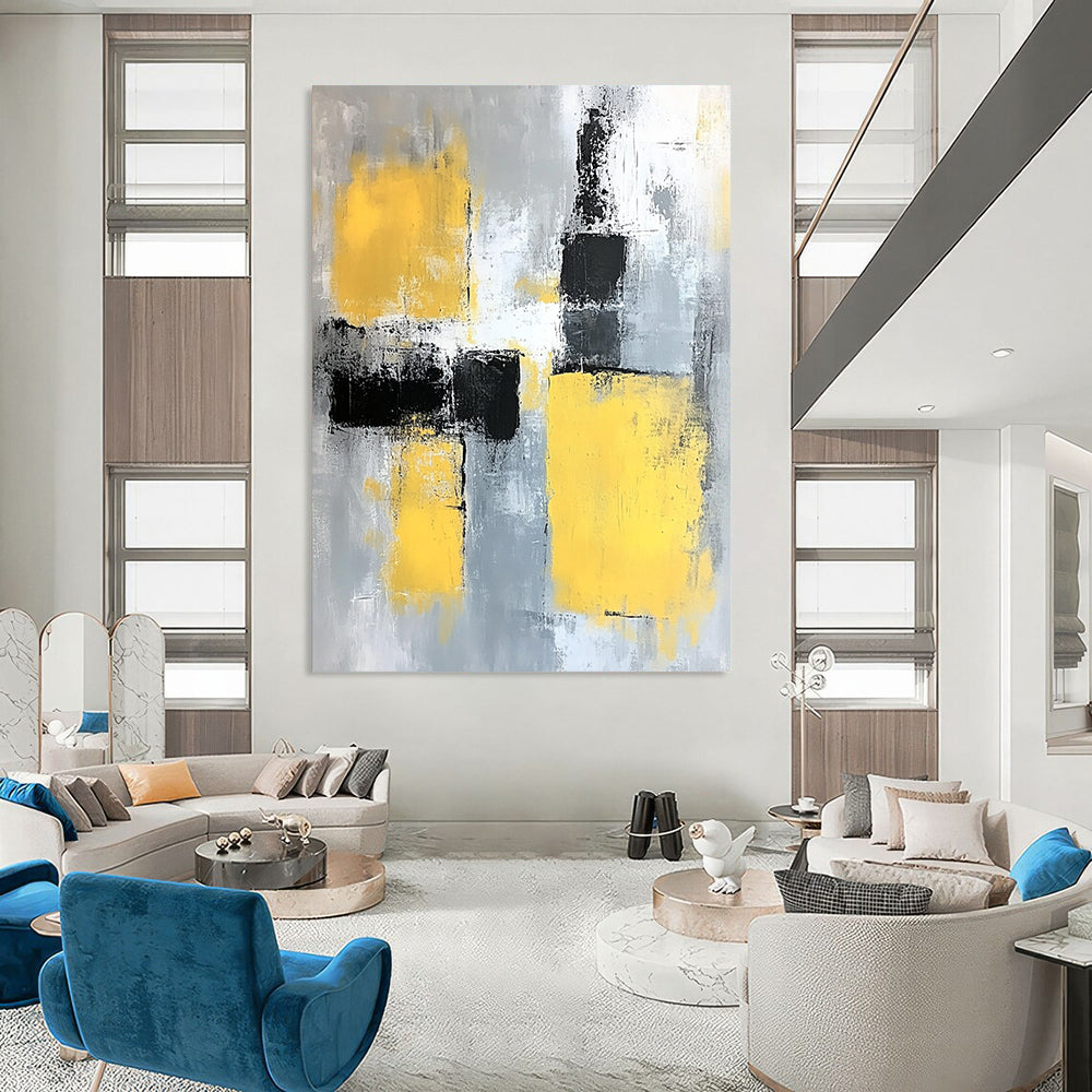 Contemporary abstract painting featuring gray and yellow color blocks with soft edges and dynamic brush strokes on a large canvas. DLZ0522