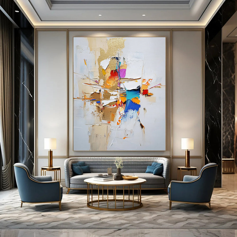 Contemporary large abstract painting featuring gold leaf and textured strokes in neutral tones with vibrant accents on a white background. DLZ0744