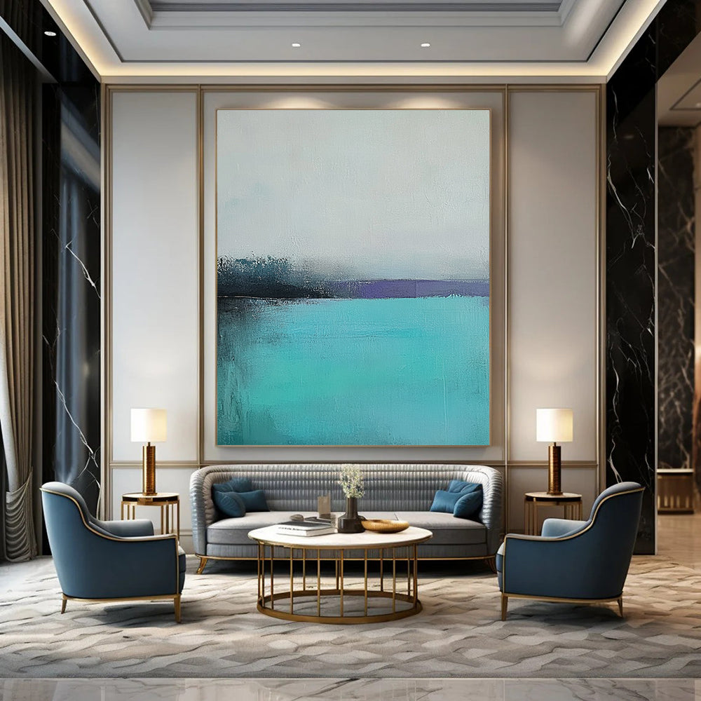 Large contemporary hand-painted abstract artwork captures a tranquil turquoise sea with a misty gray sky using muted colors and soft brush strokes for emotional depth. DLZ0428