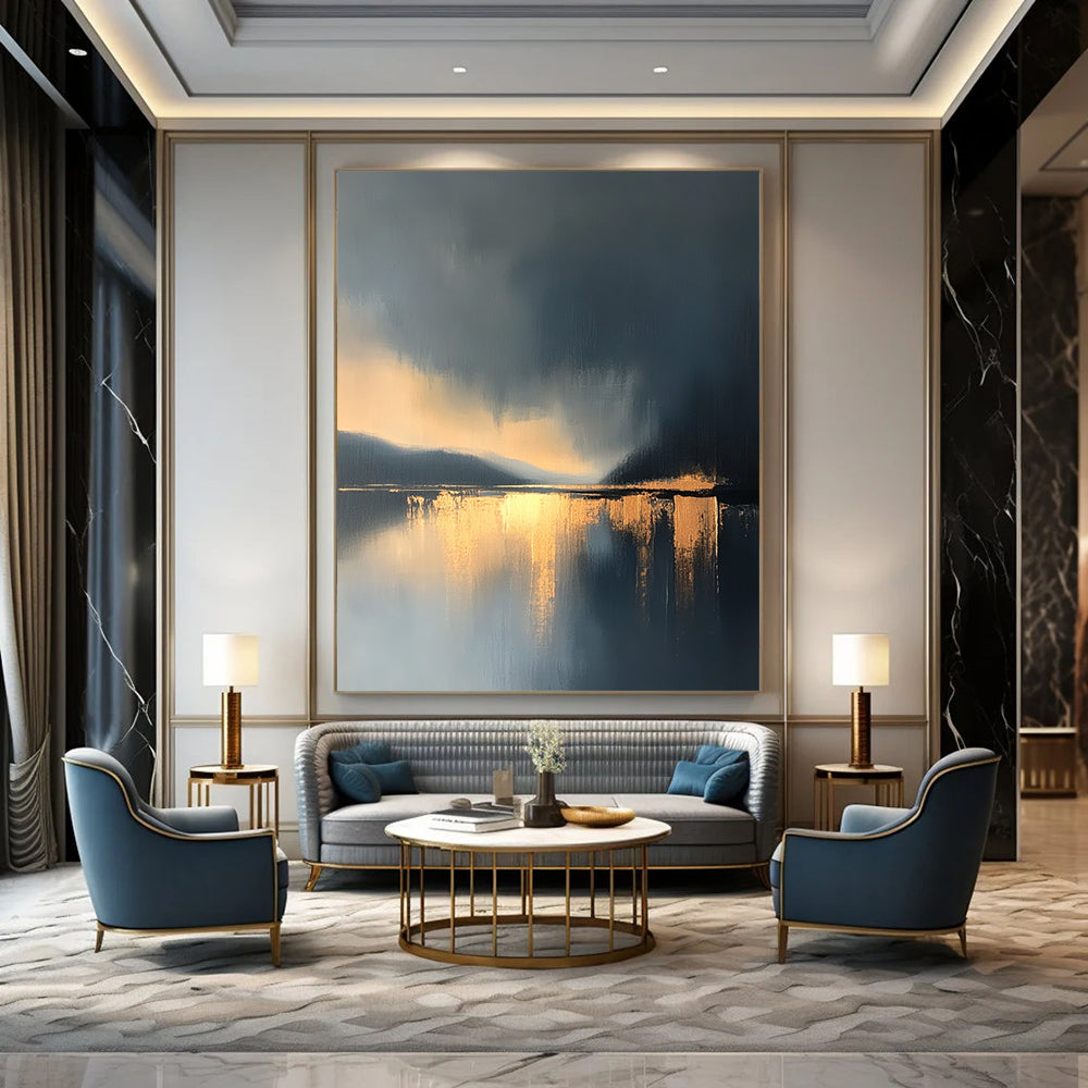 Large contemporary abstract painting features a lake and sky with golden light reflections and atmospheric clouds in minimalist modern art style. DLZ0470