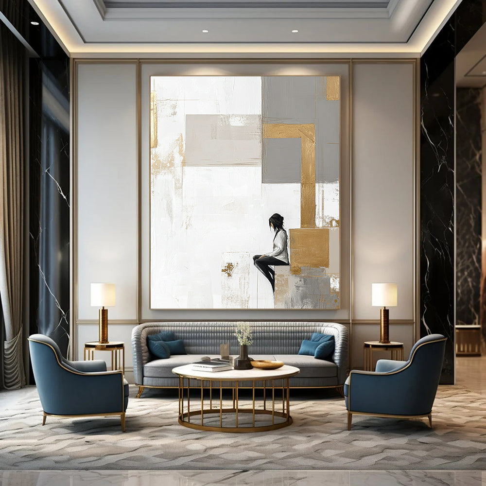 Contemporary abstract artwork features large neutral squares with gold accents on a white backdrop complemented by pale gray and beige elements. DLZ0626