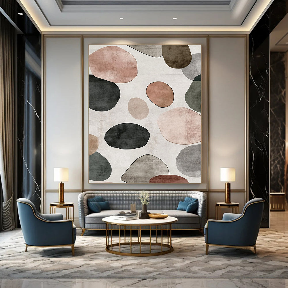 Contemporary hand-painted abstract artwork features a serene design of overlapping circles and pebbles in shades of gray with brown green and pink accents. DLZ1646