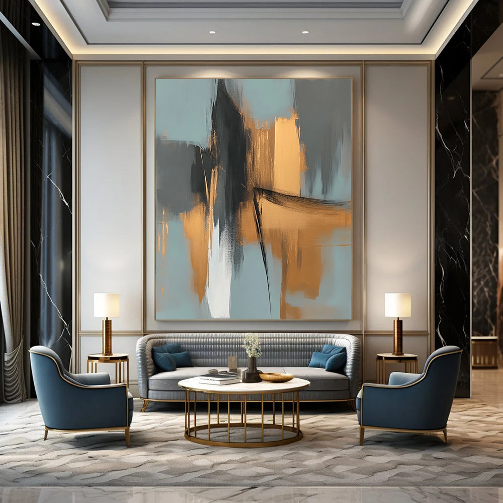 Large contemporary abstract painting features elegant gold and gray shapes against a light blue background evoking an urban landscape with serene organic forms. DLZ0706