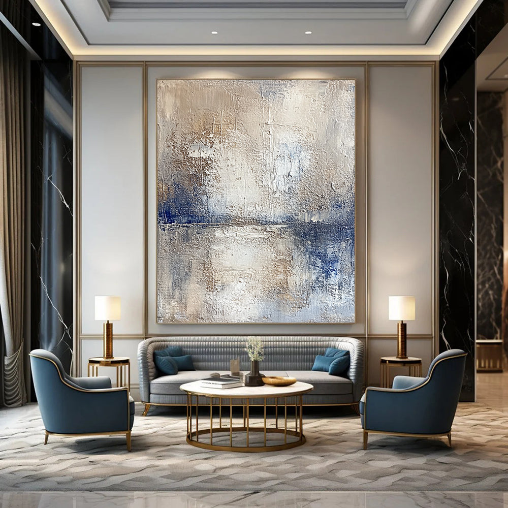 Contemporary hand-painted abstract artwork depicting a serene lake and sky with textured beige tones and vibrant blue accents for a striking visual experience. DLZ0471