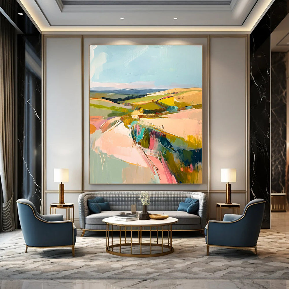 Large contemporary abstract painting featuring a pastel palette of pinks greens and yellows capturing the beauty of Welsh rolling hills and blue skies. DLZ1003