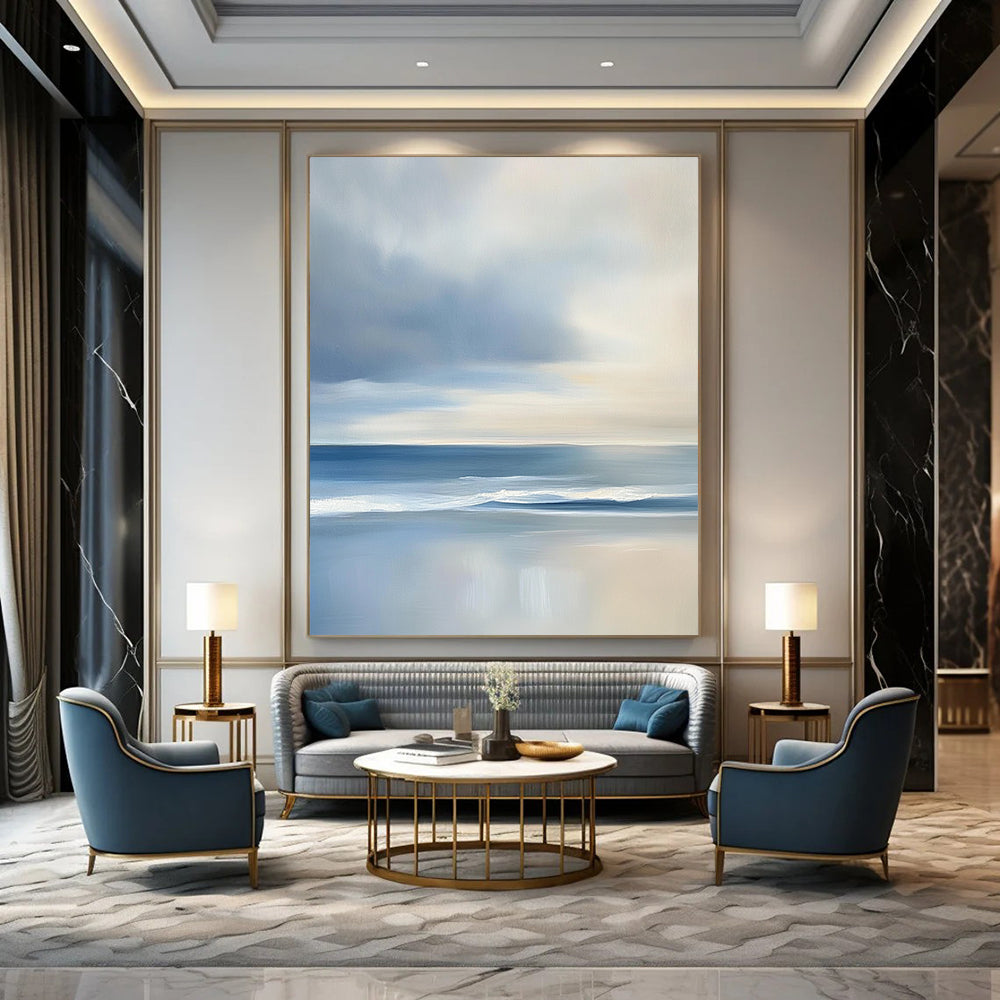 Contemporary abstract artwork features a serene ocean with gentle waves and soft clouds, showcasing light blues and grey tones for a tranquil ambiance. DLZ1460