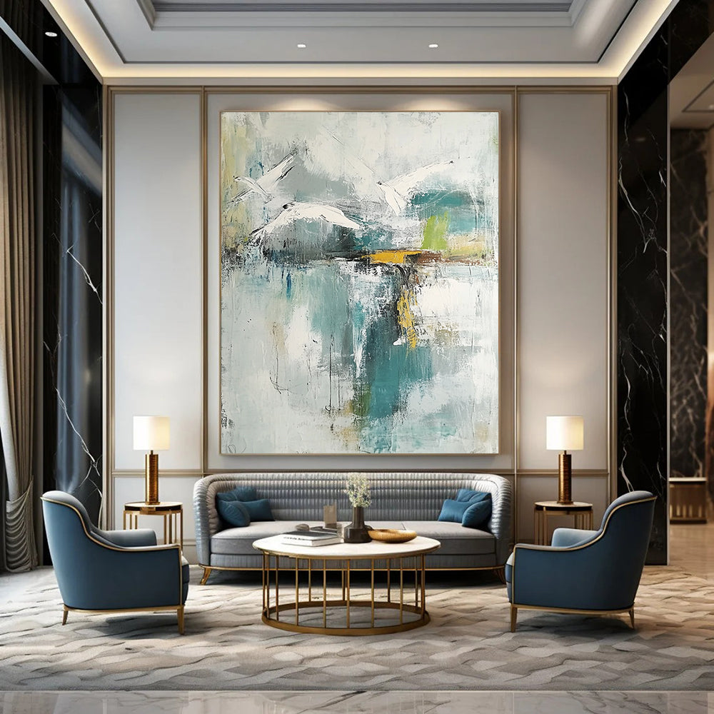 Contemporary hand-painted abstract artwork features neutral hues with teal and gold accents soft watercolors evoke birds over a lake with serene reflections. DLZ0758