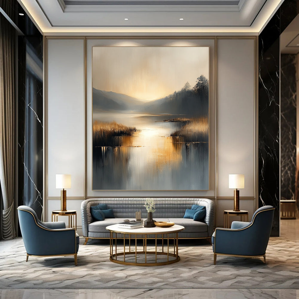 Contemporary abstract painting with soft gray and beige tones reflecting on water evokes serenity in a large canvas illuminated by golden hour light. DLZ0417