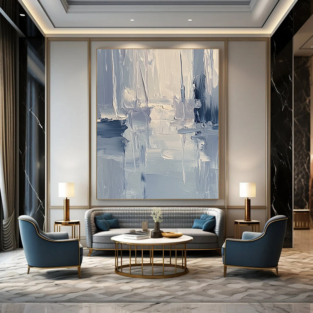 Large contemporary abstract painting featuring textured layers of blue and gray tones with soft lighting reflecting a serene coastal landscape. DLZ0352