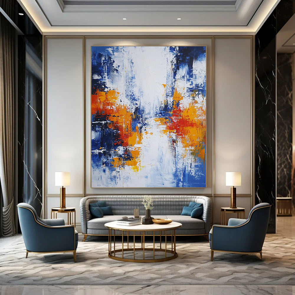 Large modern hand-painted abstract artwork featuring blue white and orange hues with broad brush strokes and thick impasto layers depicting an urban Parisian landscape. DLZ0732