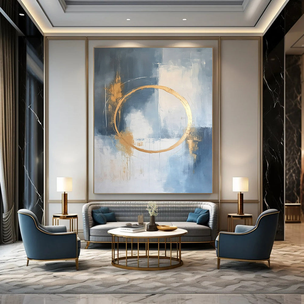 Large contemporary abstract painting features a light blue and white background with gold accents and elegant lines for a high-end aesthetic. DLZ0545