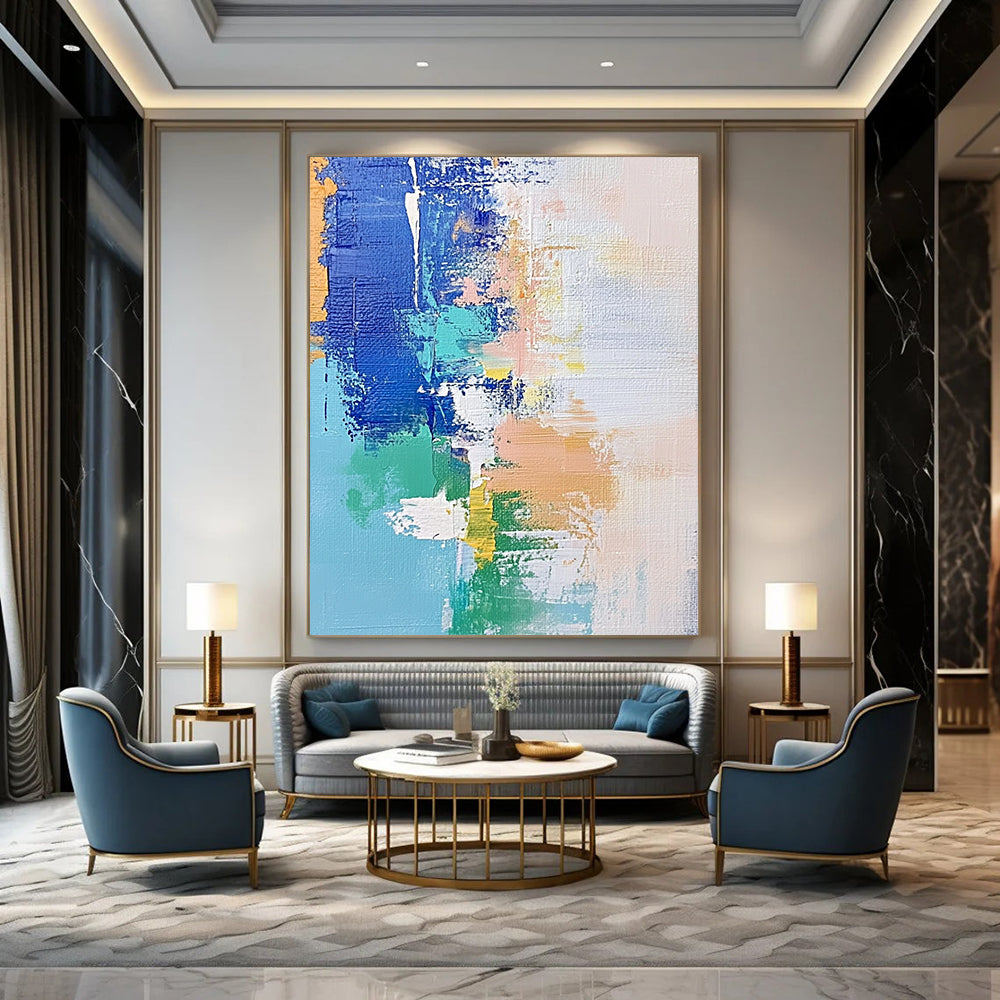 Contemporary hand-painted abstract artwork features soft pastel shades of blue and white with hints of green and beige, enhanced by dynamic brush strokes and mixed media. DLZ0657