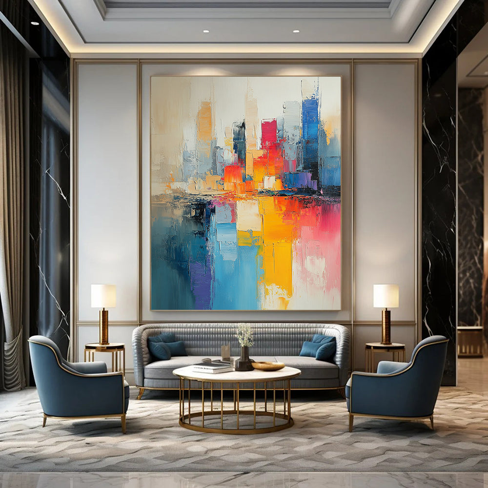 Contemporary hand-painted abstract art featuring a cityscape in muted beige and light blue tones with vibrant pinks yellows and expressive brushstrokes. DLZ0591