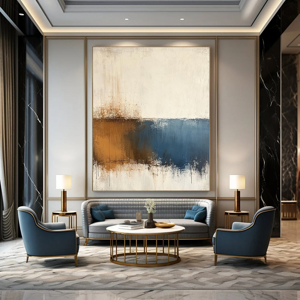 Contemporary hand-painted abstract art features beige and blue tones on a textured white background with minimalist soft edges and subtle brown accents. DLZ0725