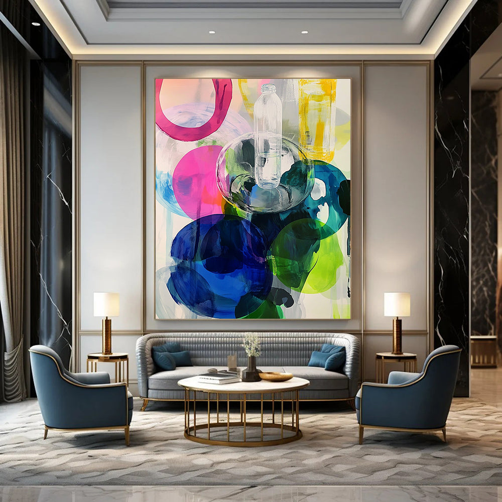 Contemporary abstract artwork featuring large round shapes in vibrant pinks blues greens and yellows enhanced with transparent plastic bottles. DLZ0984