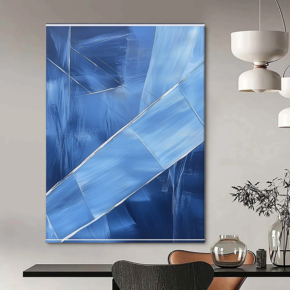 Contemporary hand-painted abstract art featuring blue shapes overlapping with soft edges and textured brushstrokes accented by a large white frame on the canvas. DLZ0367