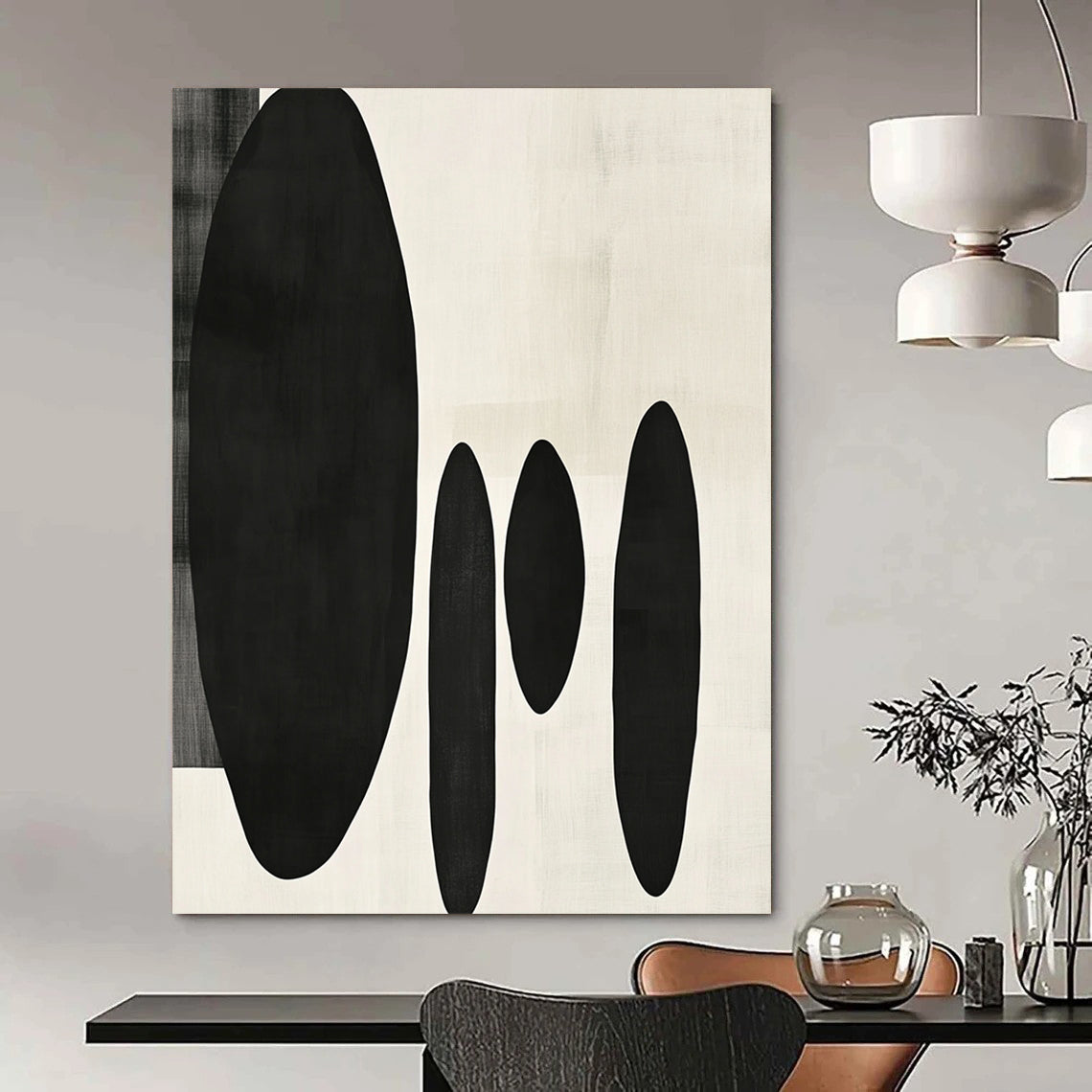 Contemporary minimalist artwork featuring organic black shapes balancing large forms on the left with delicate smaller shapes on the right. DLZ1547