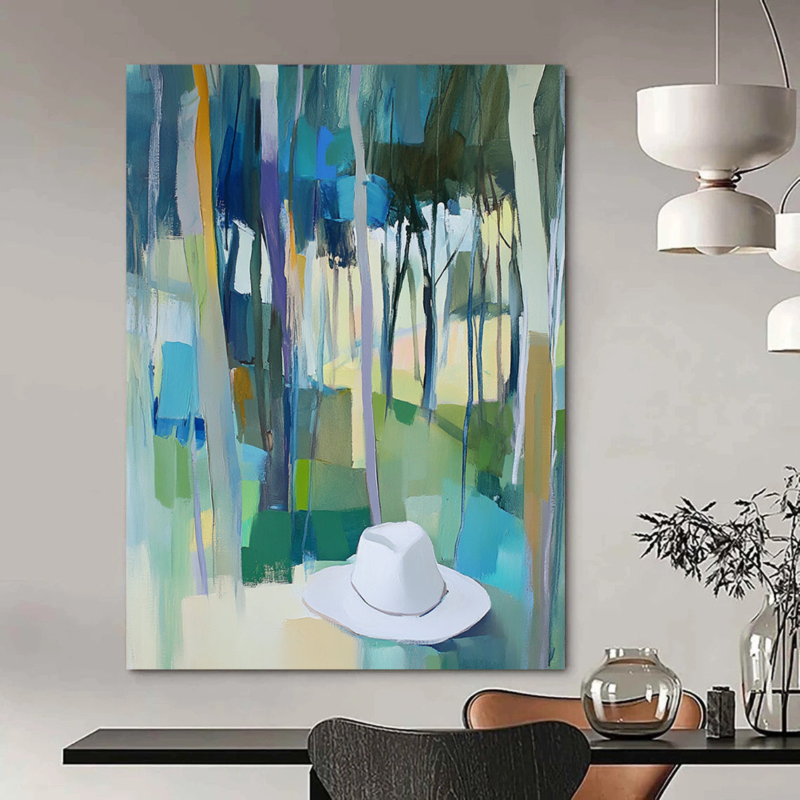 Contemporary abstract painting featuring trees in vibrant blue, green, and yellow hues with a white hat resting on the ground. DLZ0897