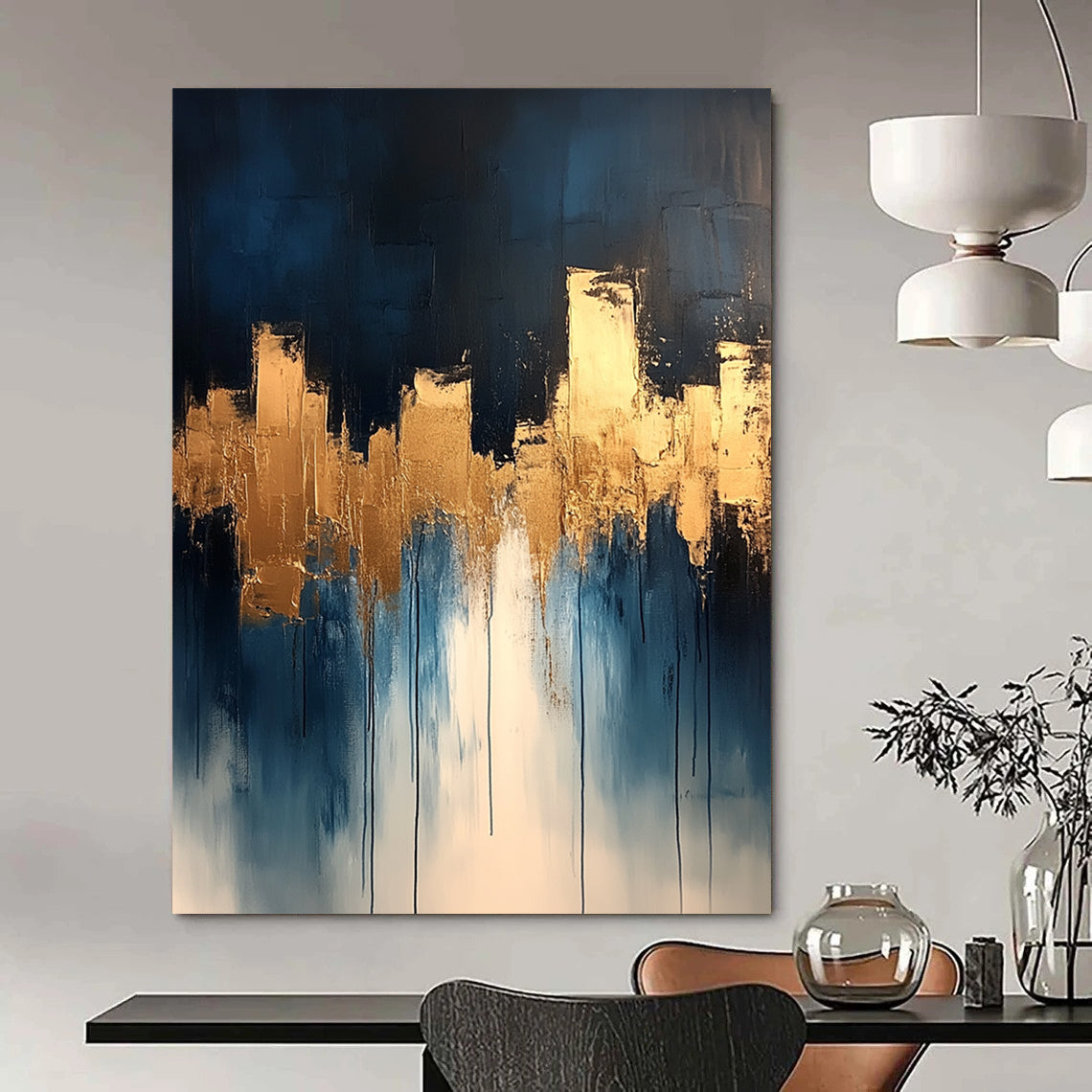 Contemporary abstract painting features dripping white and gold paint on canvas with vibrant blue tones and metallic gold leaf accents. DLZ0333