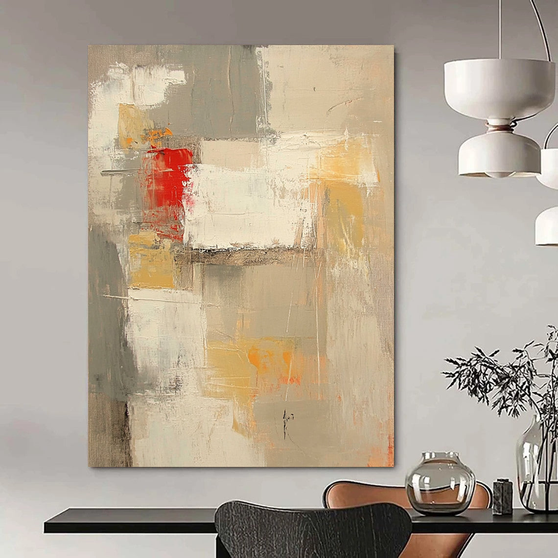 Contemporary abstract painting features neutral tones with red and yellow accents large brush strokes and textures in expansive white spaces. DLZ0921