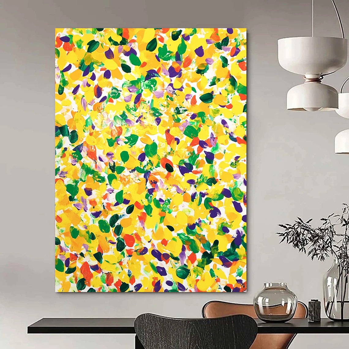 Vibrant contemporary abstract art featuring a large yellow canvas splashed with joyful green and purple spots against a clean white background. DLZ1297