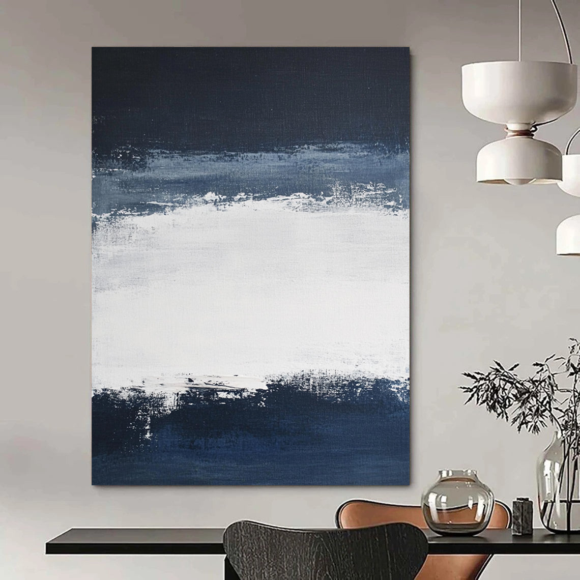 Large contemporary abstract painting featuring broad brush strokes in white and navy blue creating a tranquil atmosphere with a serene dark sky and soft gray clouds. DLZ0546