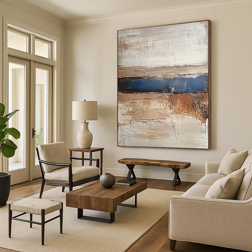 Contemporary abstract painting featuring earthy tones of beige brown grey and blue conveying calmness with a textured landscape of hills and water. DLZ1479