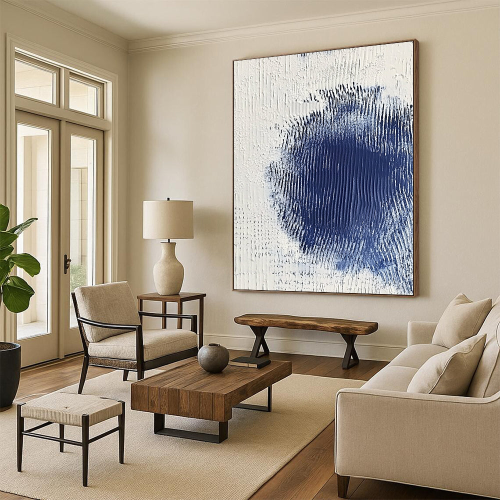 Contemporary abstract art featuring serene white and blue textures with a central dark blue spot creating depth and minimalistic elegance. DLZ1223