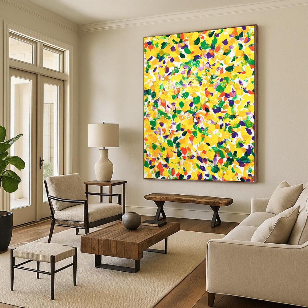 Vibrant contemporary abstract art featuring a large yellow canvas splashed with joyful green and purple spots against a clean white background. DLZ1297