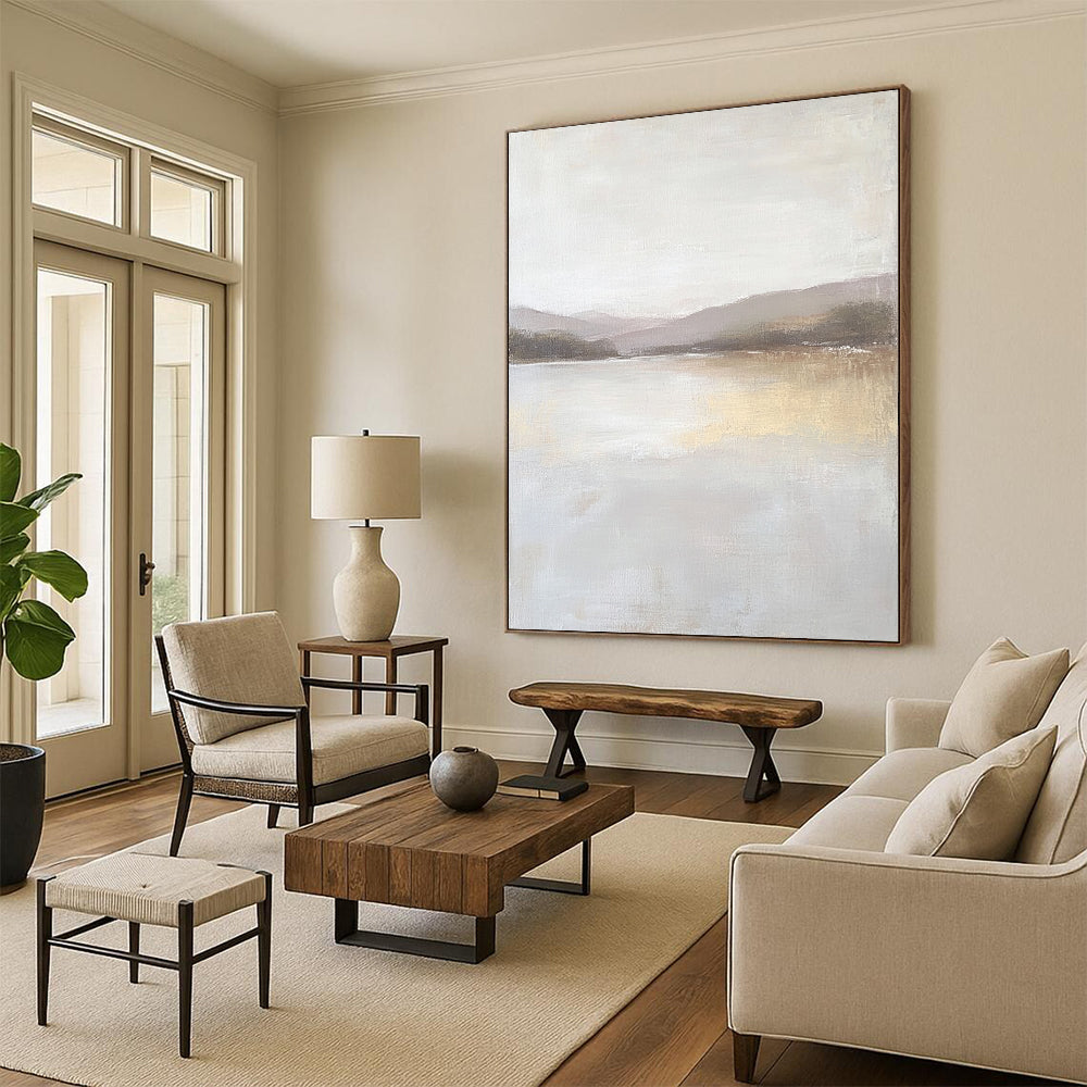 Contemporary abstract painting featuring a large lake in muted beige and gray tones with textured canvas and distant hills in the background. DLZ0415